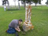 	A tour member tends an ancestor's in Immanuel Reformed Church Cemetery