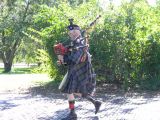 Scottish Bagpipe Player Walks the Grounds